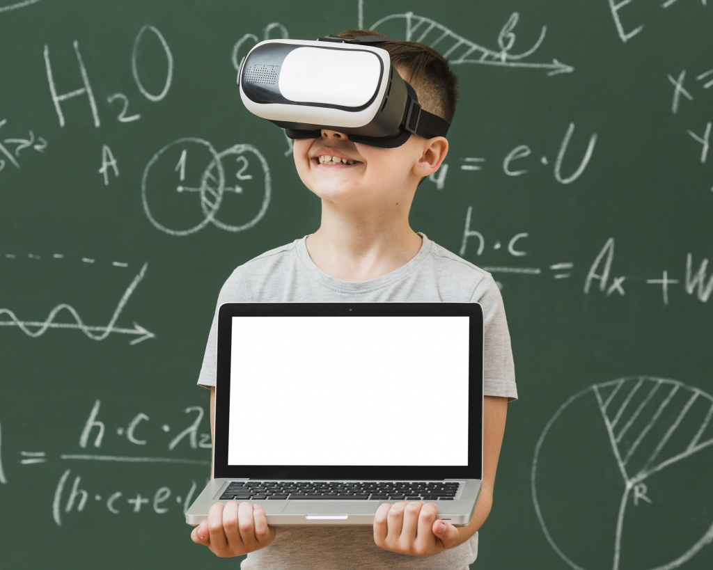 front-view-boy-holding-laptop-while-wearing-virtual-reality-headset.jpg front-view-boy-holding-laptop-while-wearing-virtual-reality-headset.jpg